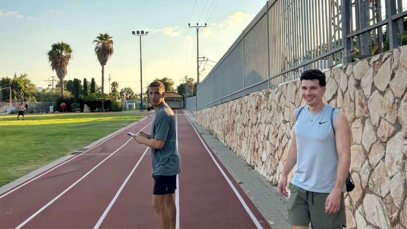 A friend on a running track.